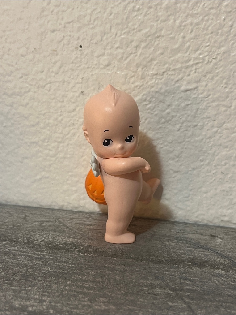 Peach-Pink Halloween Baby Doll Figure with Orange Pumpkin Accessory